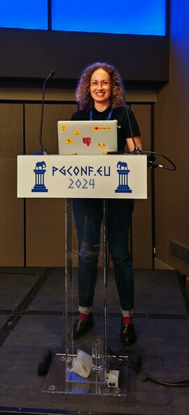 Valeria Kaplan standing behind the microphone